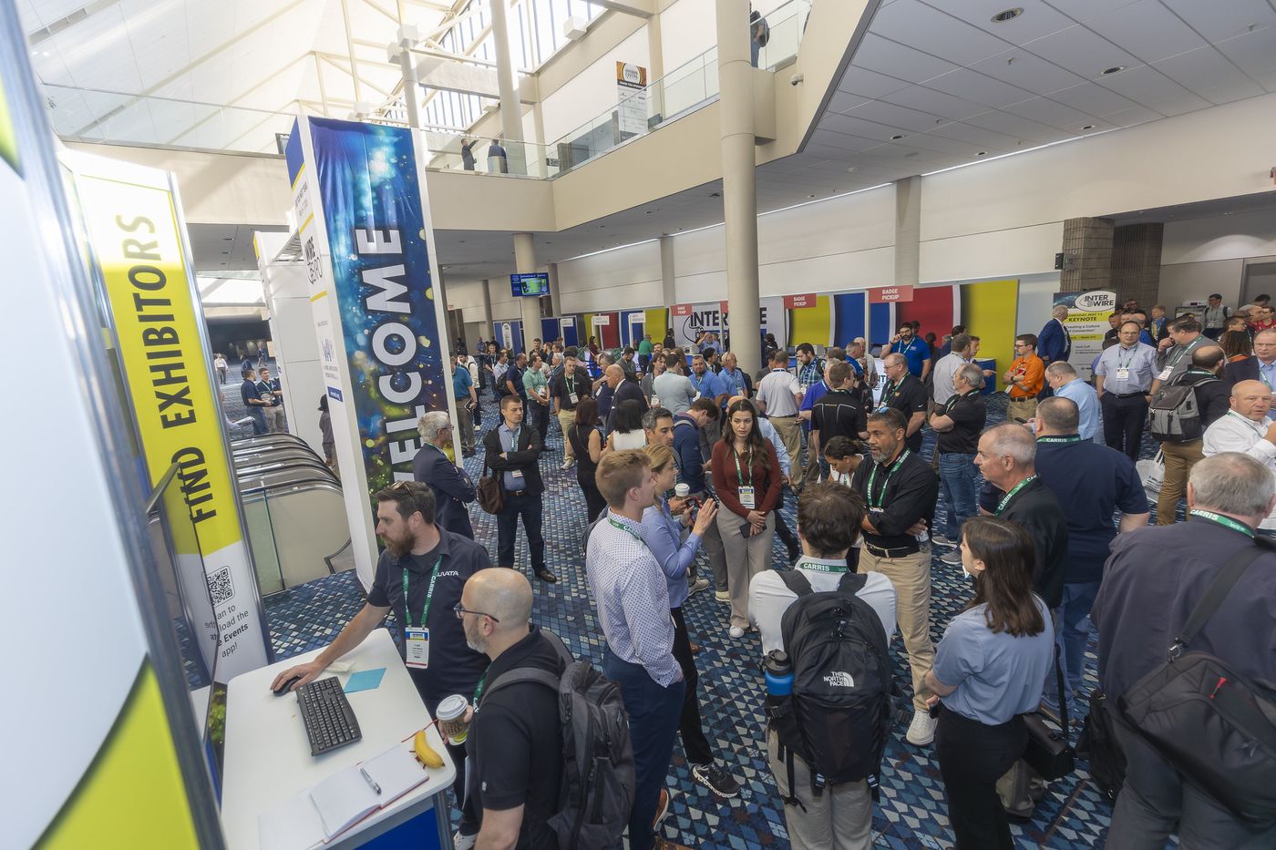 Attendees arriving at the Interwire 2025 exhibit hall entrance
